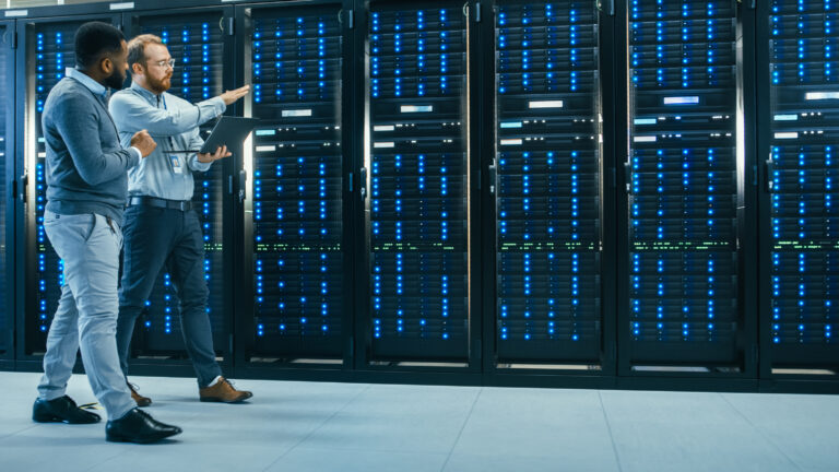two people walking in a data center