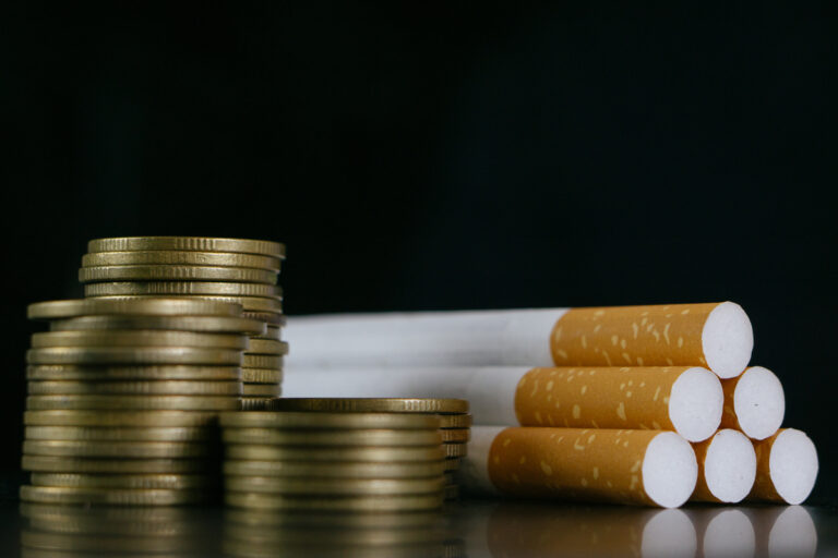 24 04 11 a pile of coins next to a bunch of cigarettes mf dload gettyimages 1352663466 1201x800 5b2df79