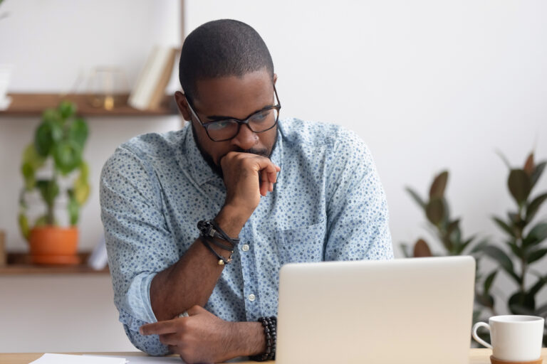 getty person feeling worried looking at a laptop