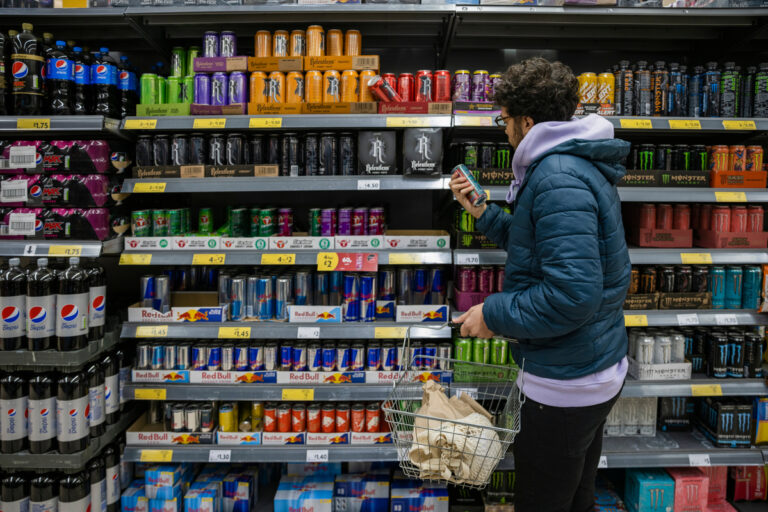 gettyimages grocery store energy drinks shopper