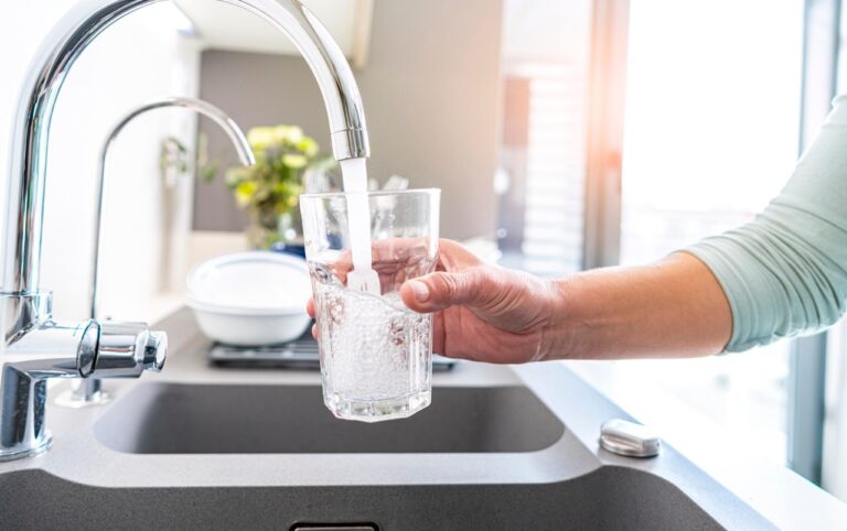 woman filling tap water