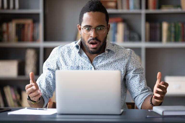 22 01 26 a person looking at a computer screen with a look of unpleasant surprise gettyimages 1216968860