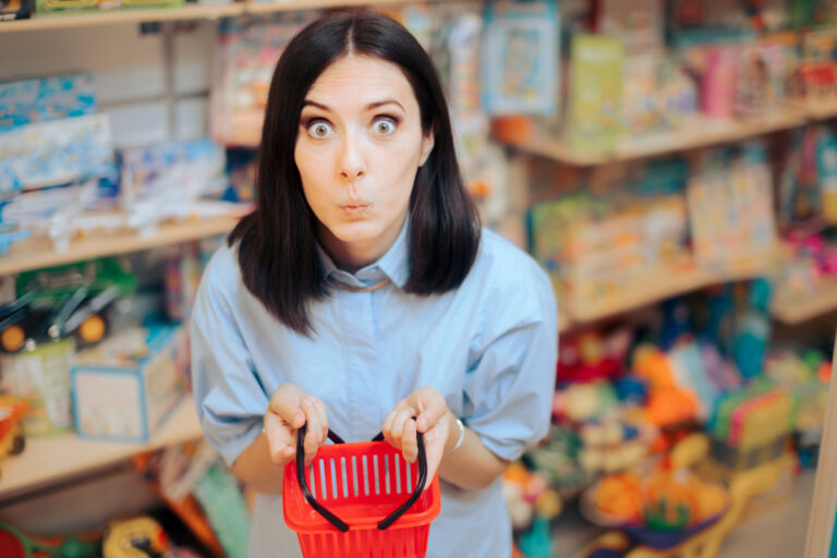 22 06 03 a person with a comically small shopping basket in a store gettyimages 1346988275