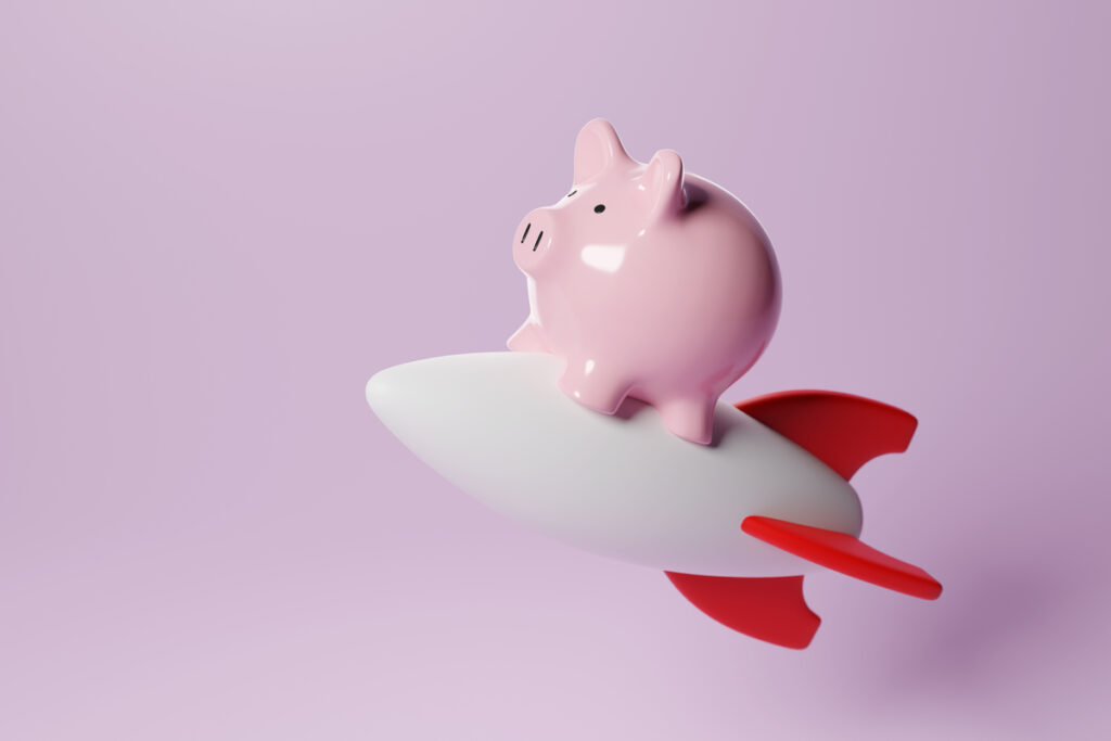 24 10 16 a piggy bank riding a rocket ship mf dload gettyimages 1498519579 1200x800 5b2df79