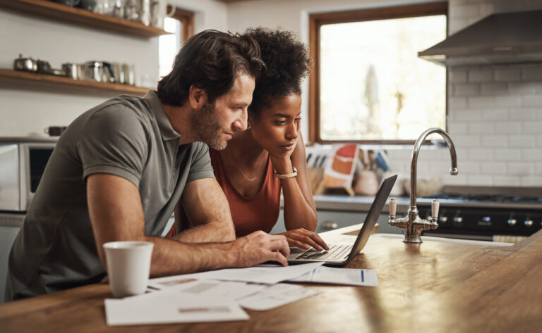 couple researching on computer