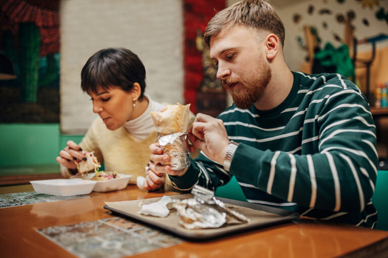 couple two people eat burrito chipotle