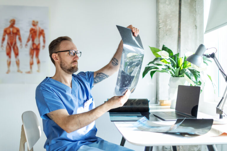 healthcare professional inspecting charts