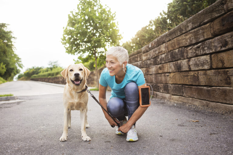 lacing up shoes before running with dog