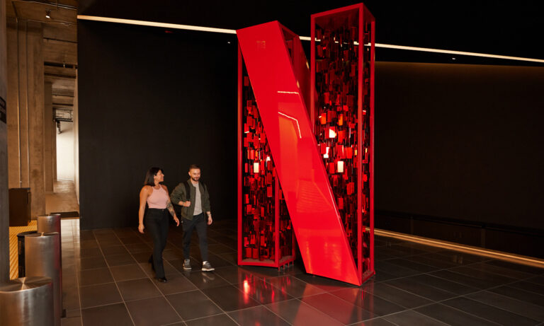 large netflix logo sculpture in lobby of office building netflix