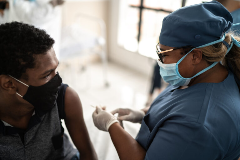 person about to receive a vaccine shot