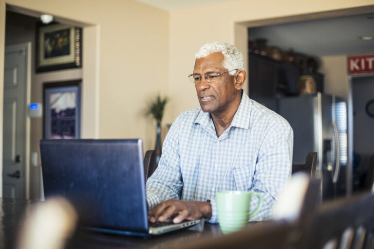 senior man laptop gettyimages 935722790