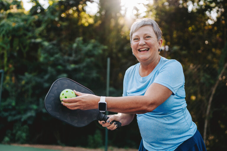 getty happy smiling pickleball player exercise fitness sports