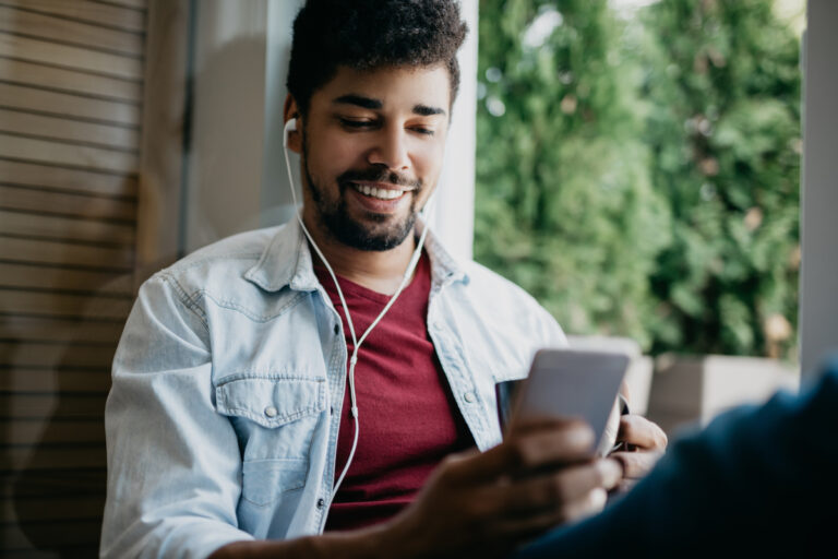 guy on computer and smartphone social media