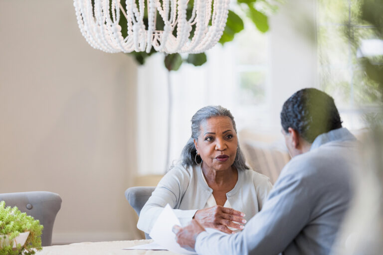 senior couple at table gettyimages 1391105721