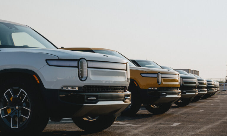 24 06 26 a line of rivian trucks in a parking lot mf dload image source rivian