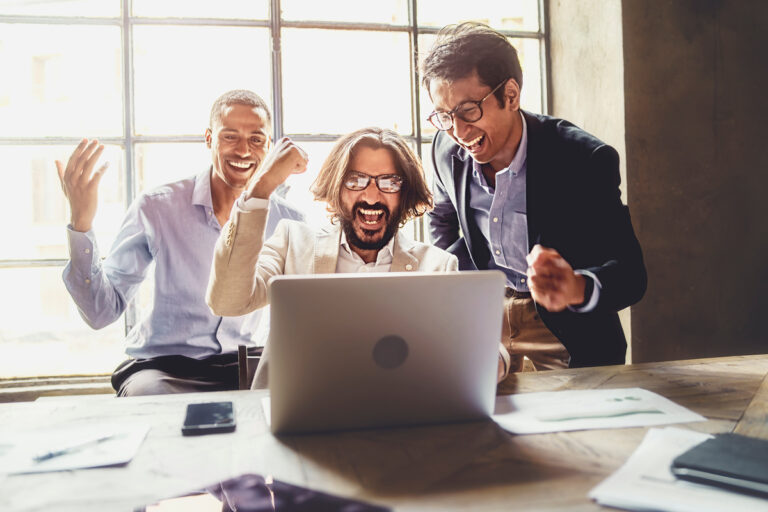 3 people excited with a computer