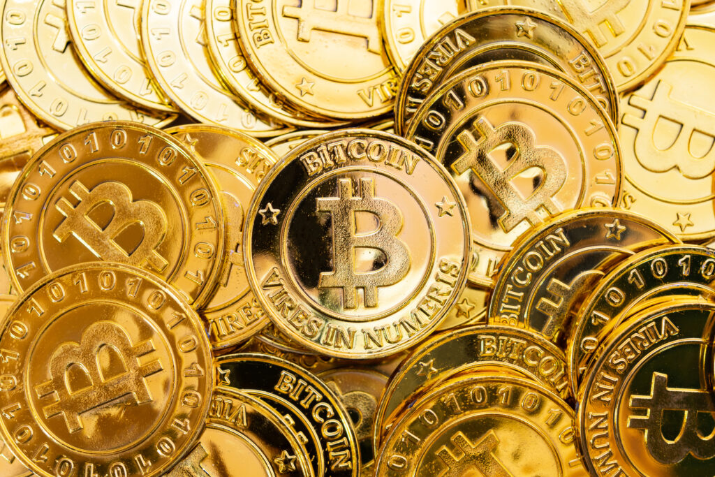 gold coins with bitcoin logo on them