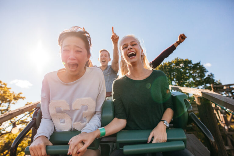 people enjoy a roller coaster ride