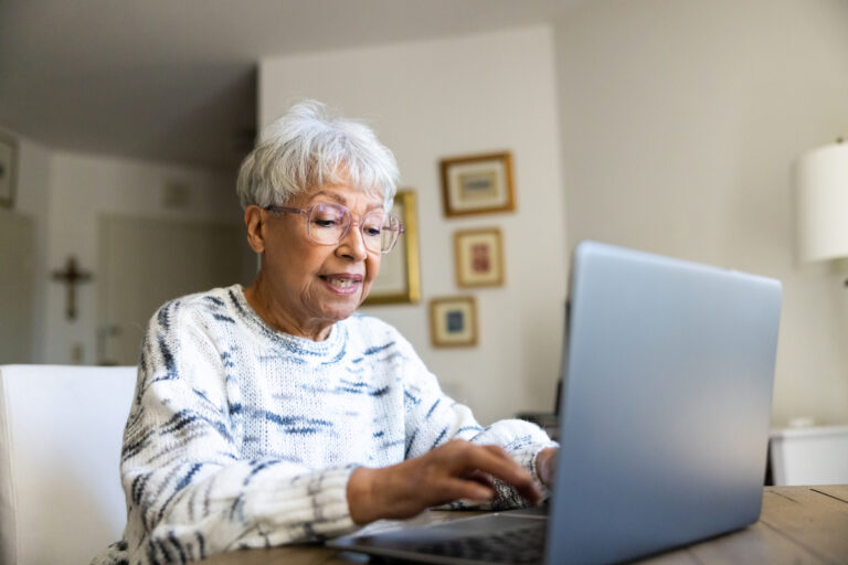 person using laptop in their home