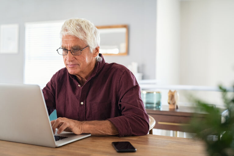 retired man finances laptop review