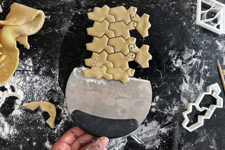tessalated cookie cutter pattern stamped into dough for holiday cookies