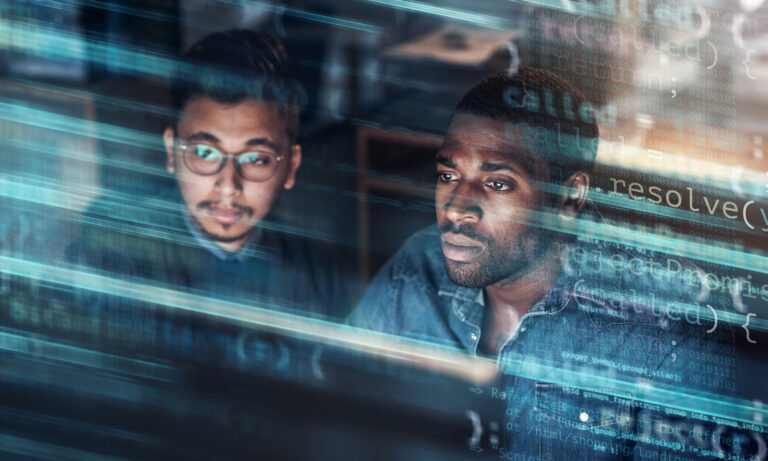 two people looking at data on a screen