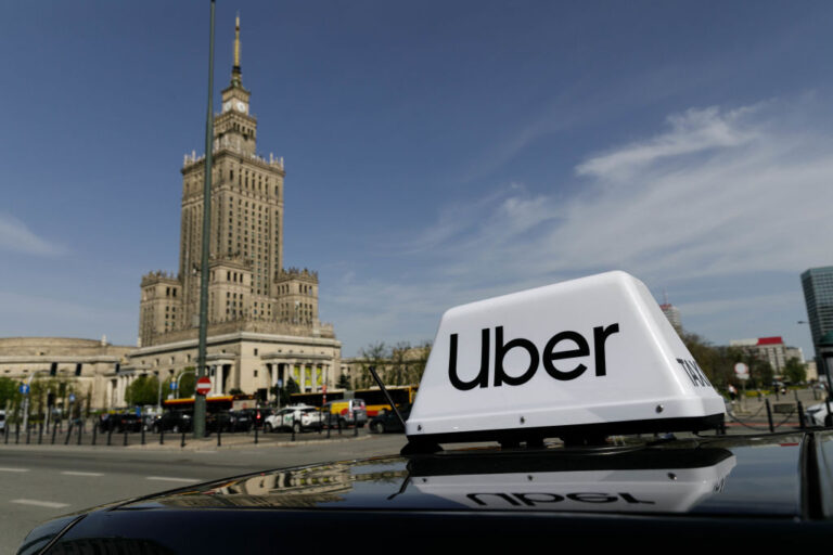 uber logo on top of car uber