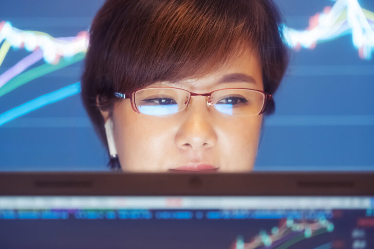 woman checking stocks analyst