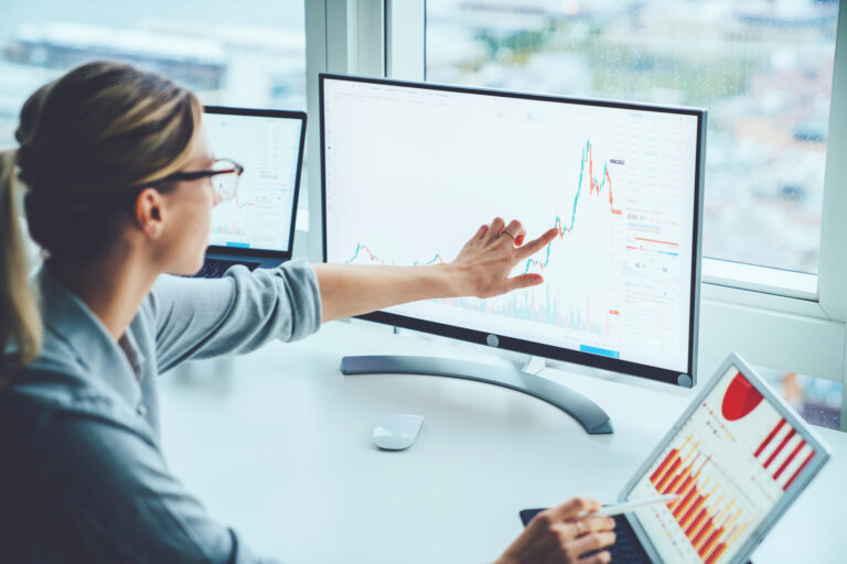 stock market person studying computer