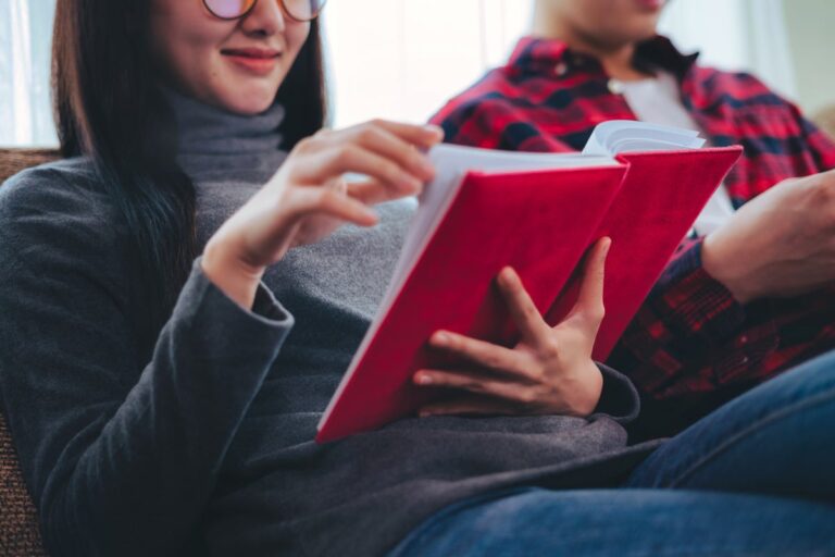 Couple on couch reading