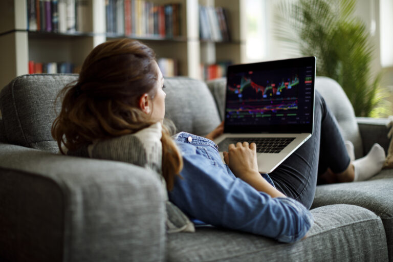 investor on couch with laptop