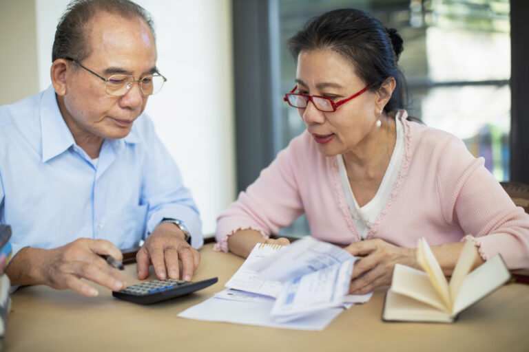 concerned senior asian couple