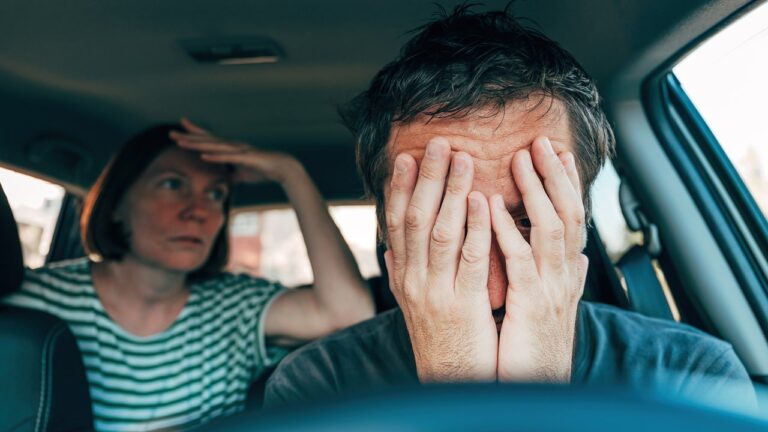 couple in car back seat driver