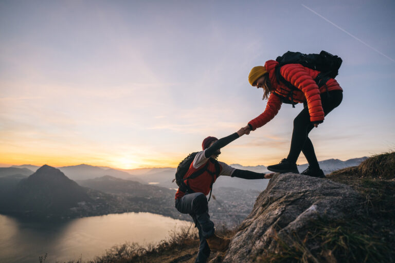 25 05 02 two people climbing a mountain together mf dload gettyimages 1361421117 1201x800 5b2df79